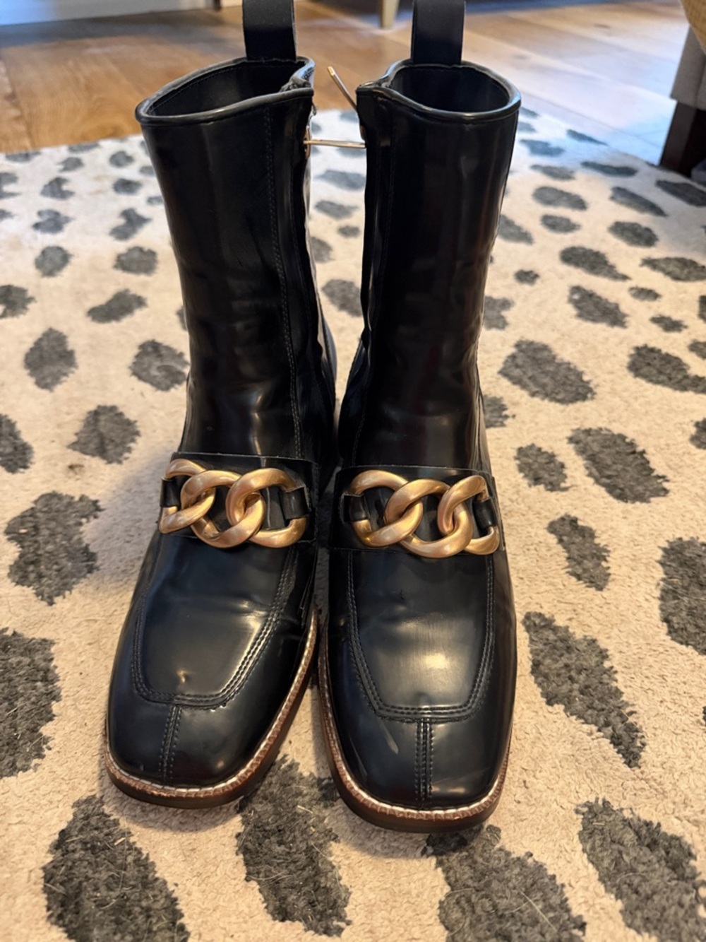 Steve Madden Loreen Black Leather Ankle Boots with Gold Chain Accent